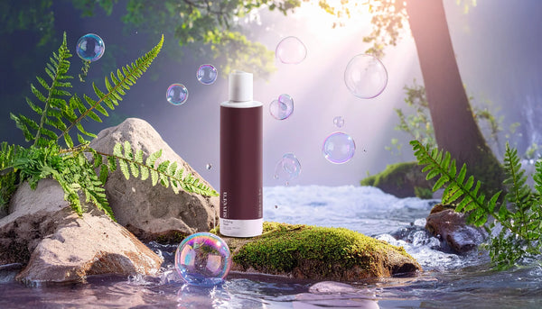 Minimalist still-life of Suvéra Soothing Toner and Anti-Age Day Cream on a mossy stone with dappled forest light, evoking digital detox and Shinrin-yoku ritual.