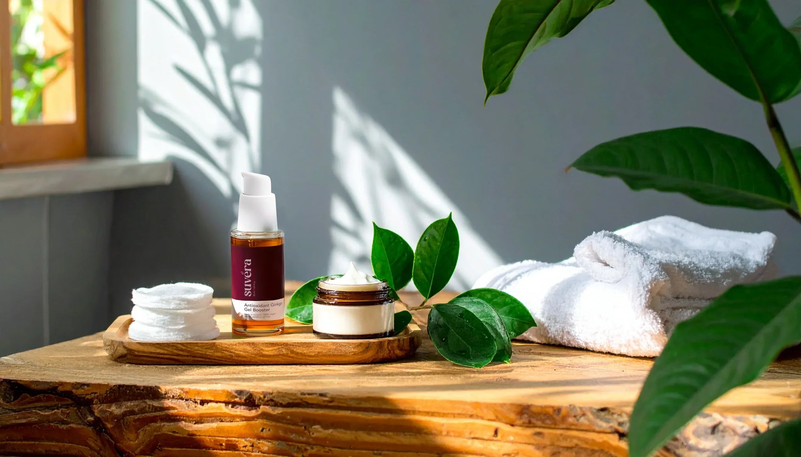 Elegant Suvera skincare products on a soft natural linen background with fresh green leaves, reflecting purity, vegan, and gluten-free values.