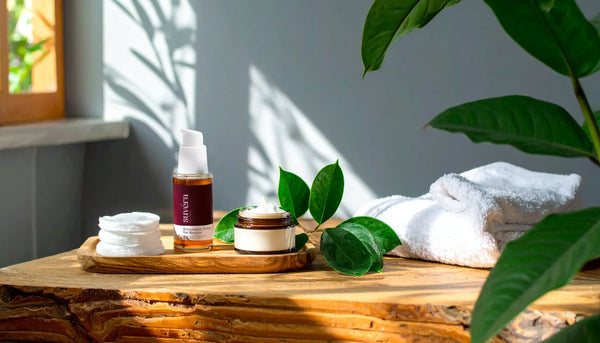 Elegant Suvera skincare products on a soft natural linen background with fresh green leaves, reflecting purity, vegan, and gluten-free values.
