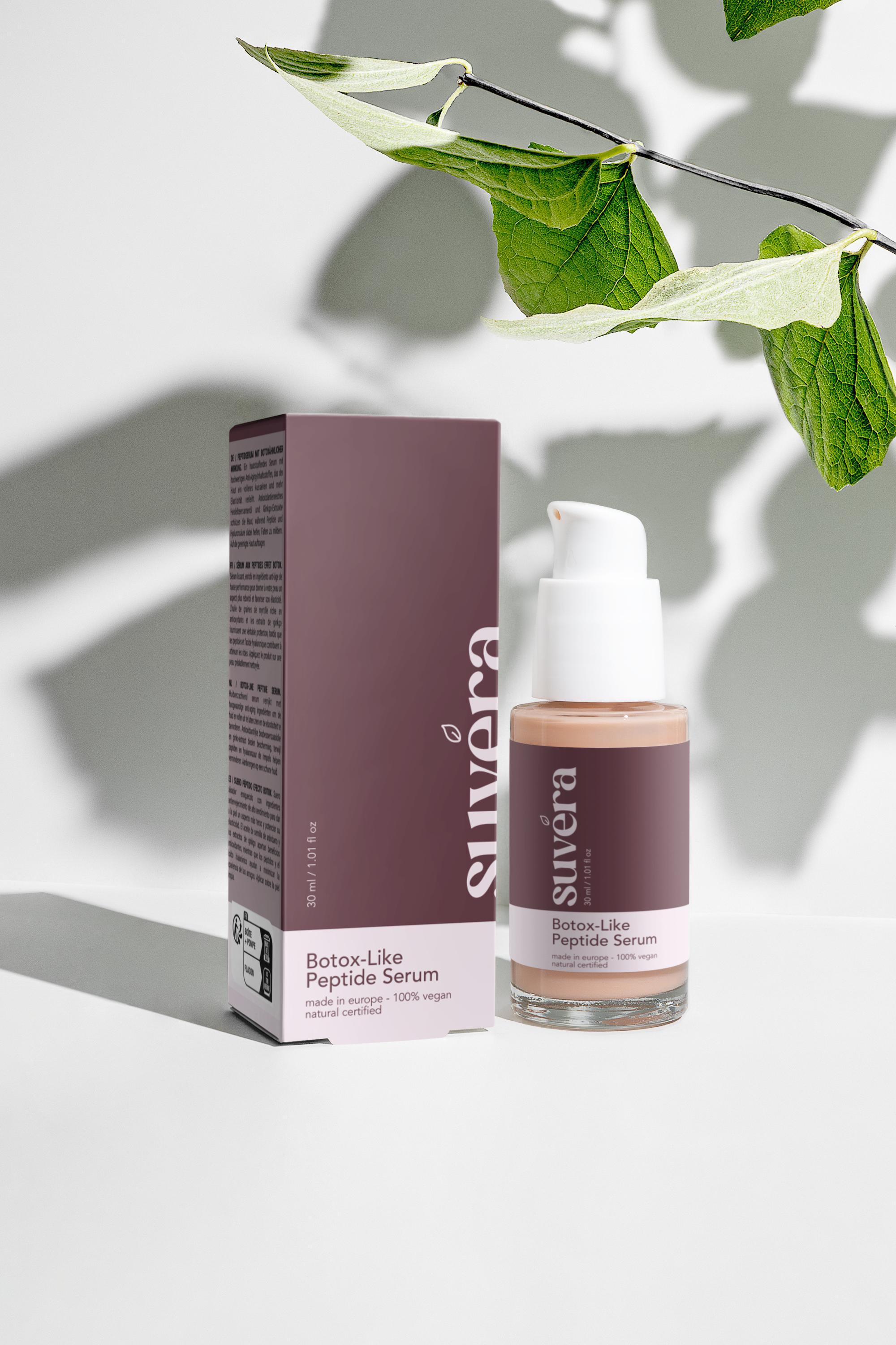 Suvera peptide serum surrounded by ginkgo leaves and blueberries – natural beauty ritual