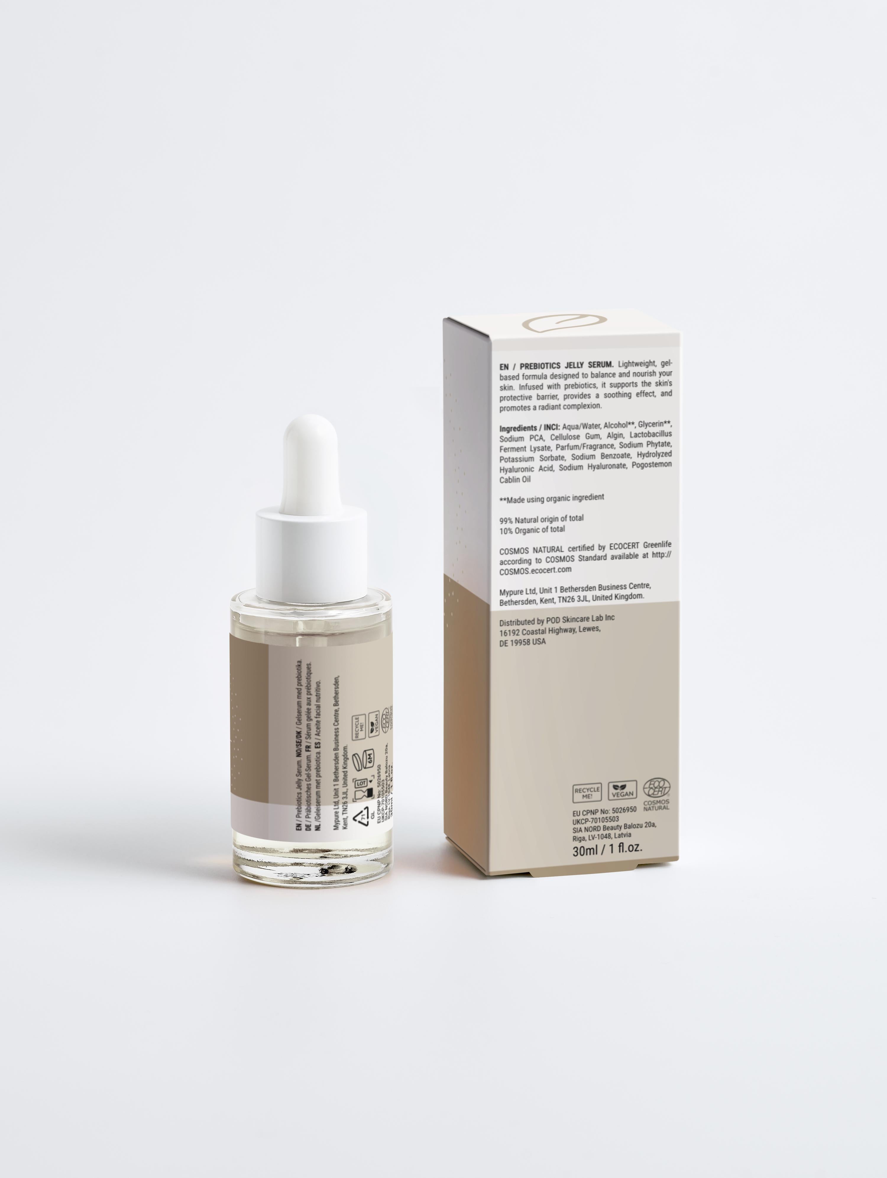 Skincare serum bottle with dropper and its packaging on a white background