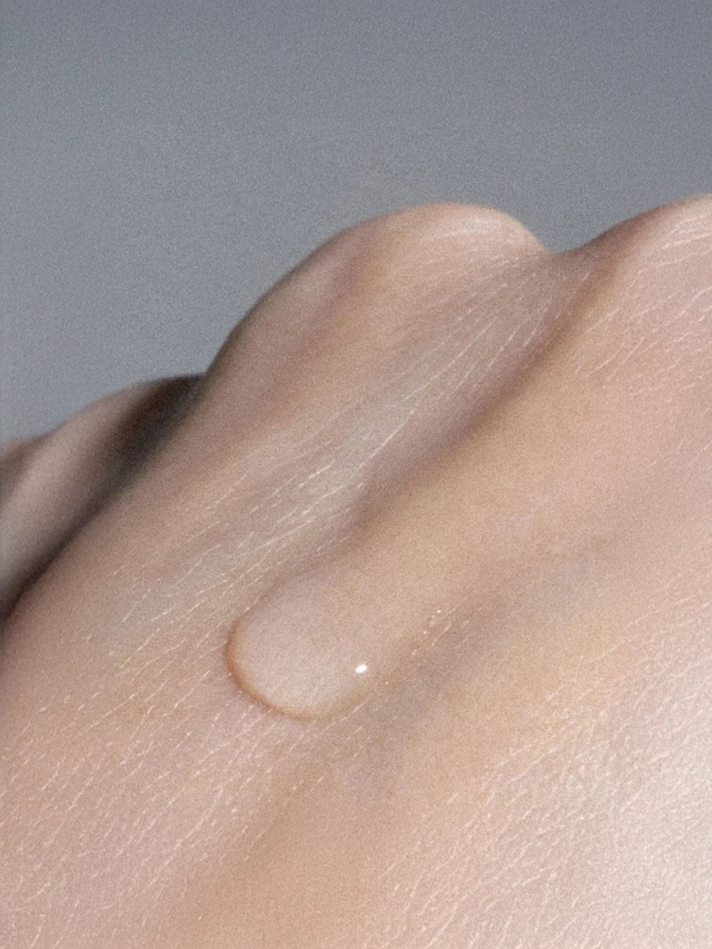 Close-up of a hand with a droplet of water on the skin Micellar Cleansing Water