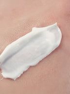 White cream or lotion applied to skin Mineral Sunscreen SPF30 for Face & Body, no tint