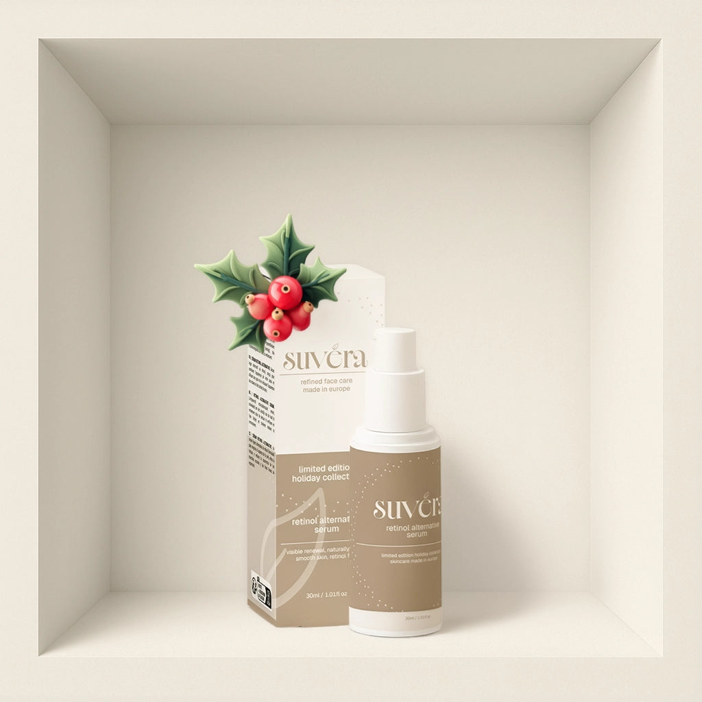 SUVERA skincare product with holly leaves and berries on a neutral background