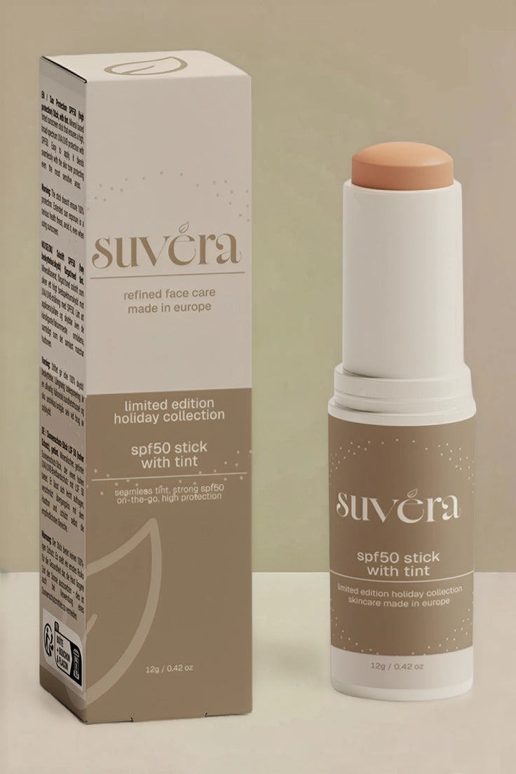 Suvéra SPF product bottle positioned beside its outer box in a neutral studio shot.