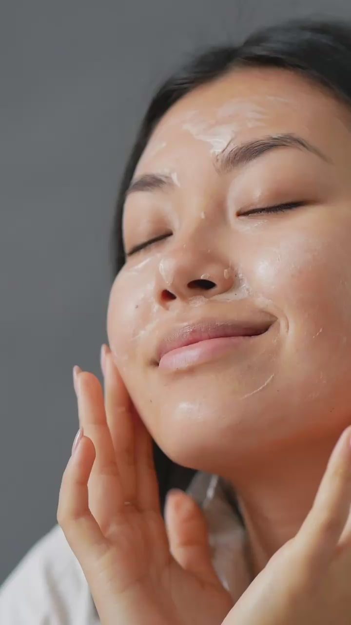 Suvera female model using vegan natural skincare on her face care unique