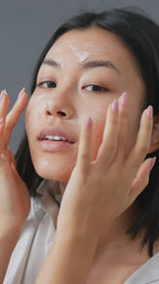 Suvéra Self Care cream swirl on a glass platter resting on a folded blanket; minimalist, light and airy scene.