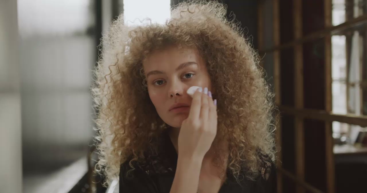 Curly model woman removing makeup naturally vegan with BiPhasic Make-up Remover, Fragrance Free