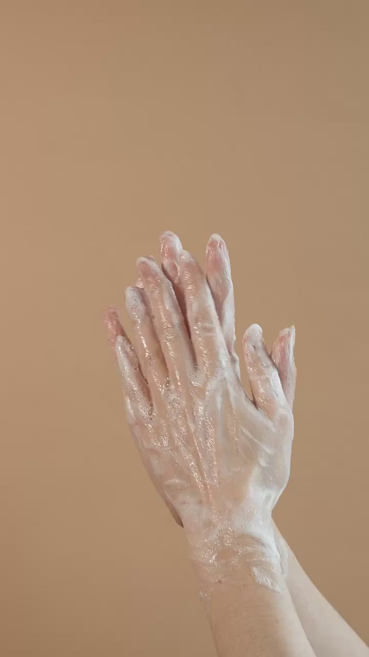 Luxurious Suvéra body wash lather on skin, rich creamy texture with botanical ingredients, vegan natural self care skincare