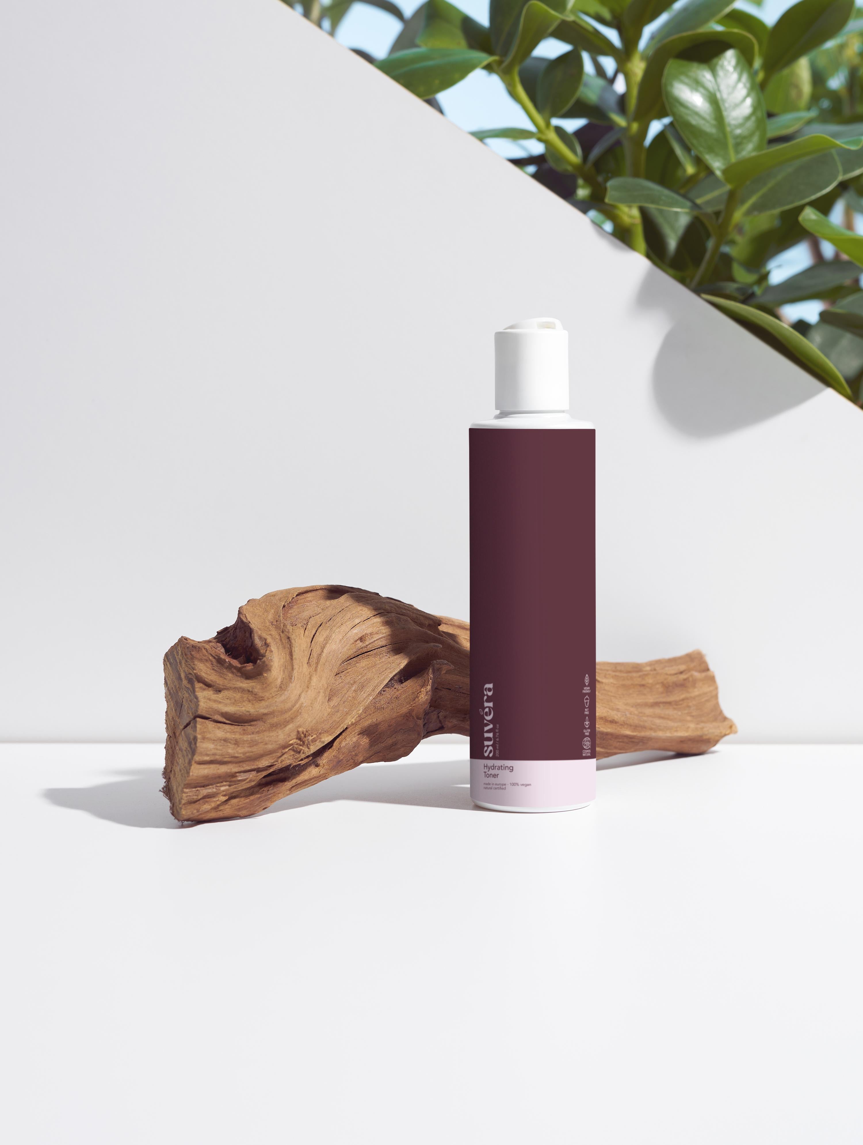Suvera's fragrance-free toner standing beside a splash of water and rose extract visuals